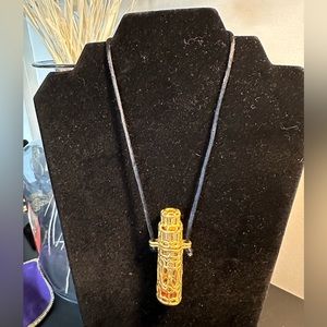 NE9 Vintage Donna Karen gold tone parfum holder medallion cord necklace